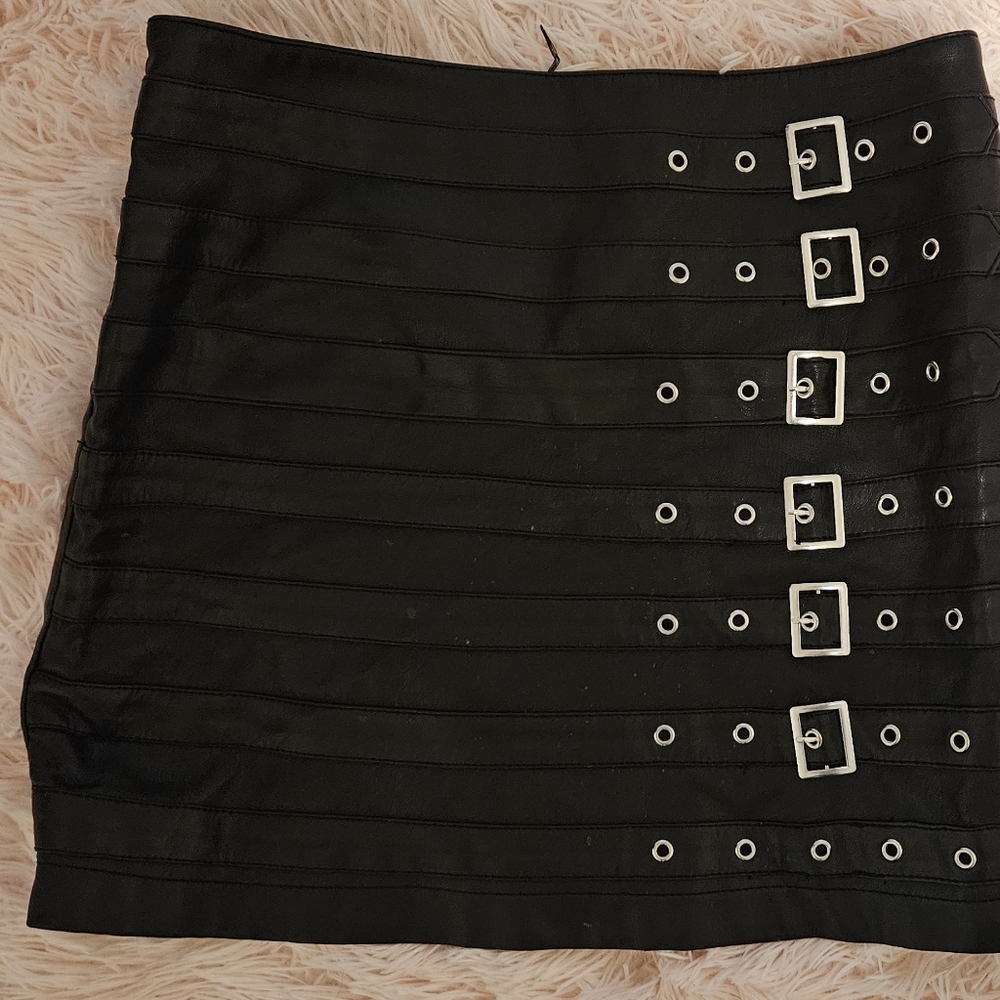 Black pleather mini skirt with silver buckles
